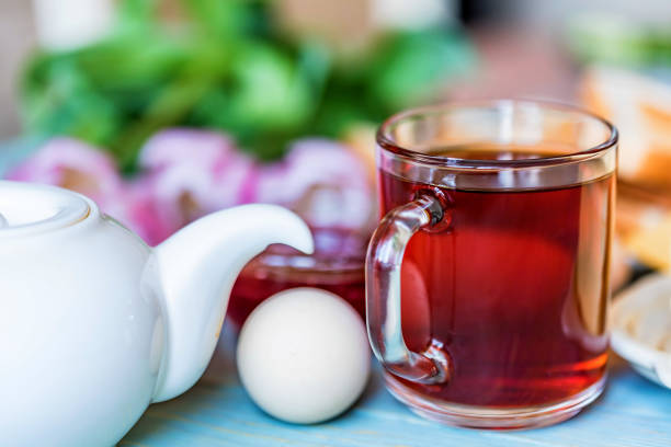 istock Breakfast with tea, jam and flowers 939218852