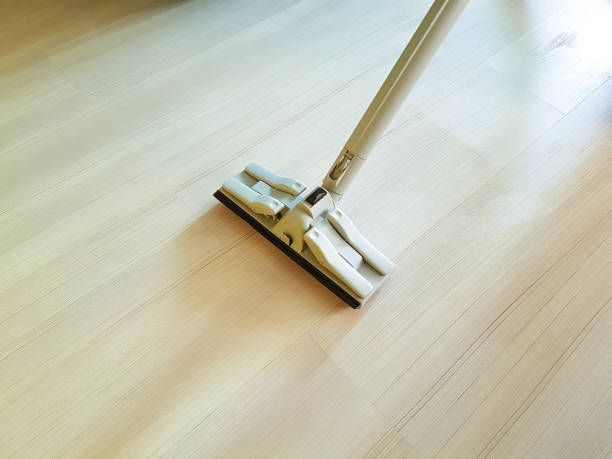 istock men vacuum the floor with steam 939218990