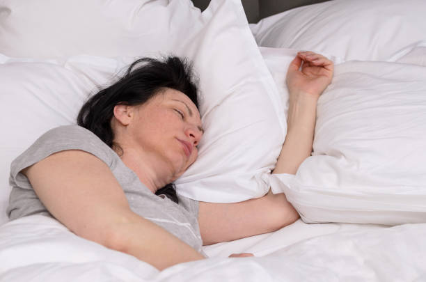 istock Young woman enjoying a good restful sleep 939219656