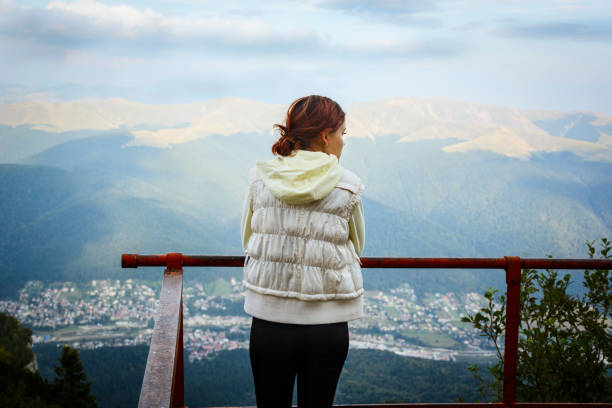 istock Smiling Young Woman on a Hiking Trail 939219854