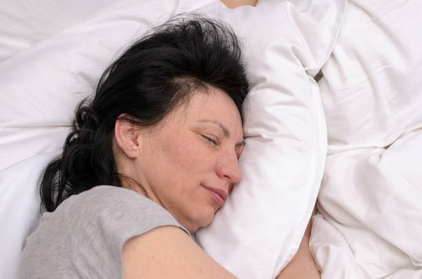 istock Young woman enjoying a good restful sleep 939219864