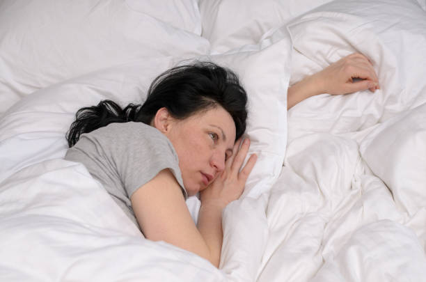 istock Young woman waking up in the morning 939220084