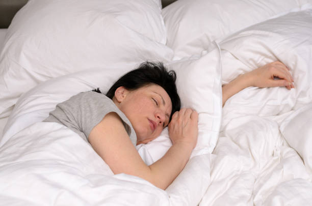 istock Young woman enjoying a good restful sleep 939222462