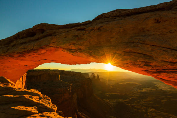 istock Scenery in the Arches National Park, Utah, with Mesa Arch under warm sunrise light 939223206