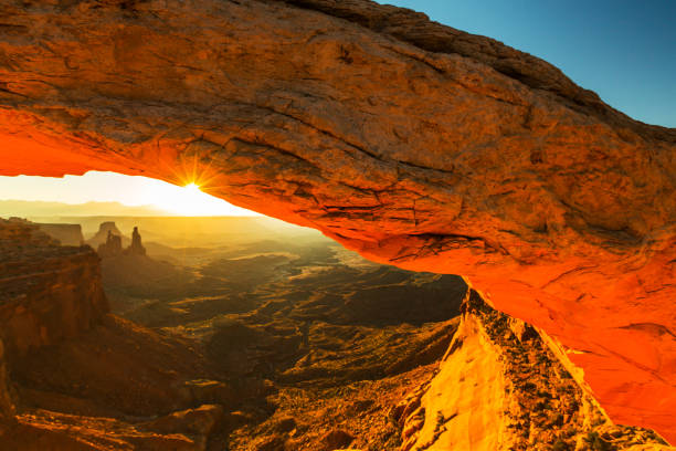 istock Scenery in the Arches National Park, Utah, with Mesa Arch under warm sunrise light 939223208