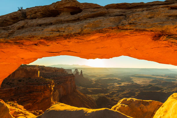 istock Scenery in the Arches National Park, Utah, with Mesa Arch under warm sunrise light 939223668