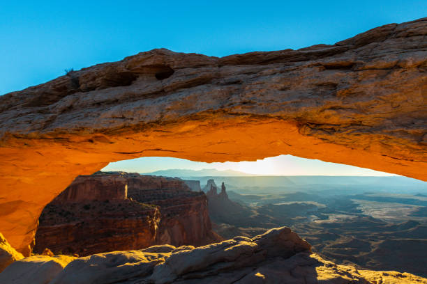 istock Scenery in the Arches National Park, Utah, with Mesa Arch under warm sunrise light 939223680