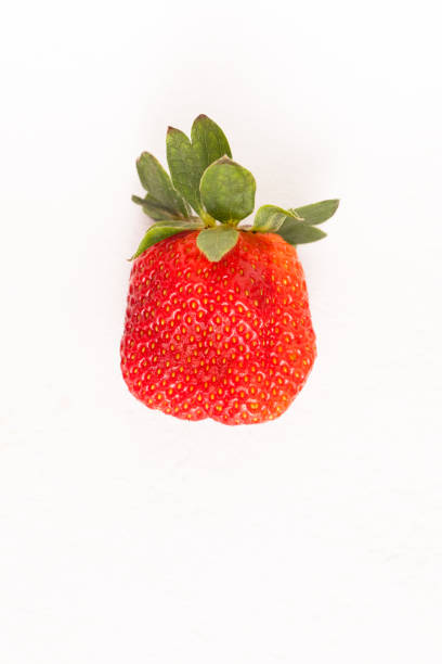 istock Ripe red strawberry on white table 939228962