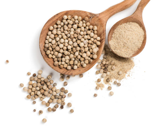istock White peppercorns and ground pepper. 939231360