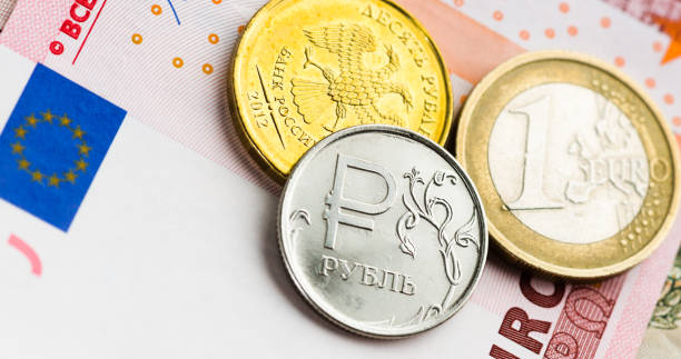 istock euro and ruble coins on euro banknotes 939231982