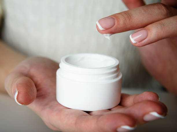 istock beautiful woman hands with cream 939234644