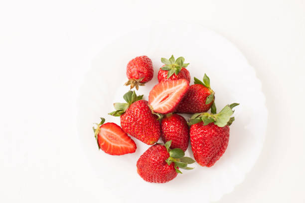 istock Ripe red strawberry on white table 939235204