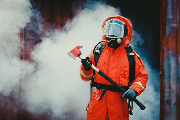 istock Firefighters fighting a fire operation, fireman holding ax, Firefighters extinguish burning warehouse 939235450