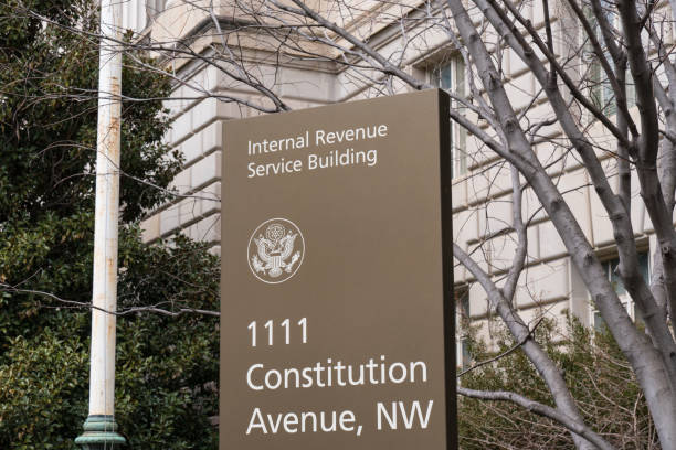 Internal Revenue Serice Sign WASHINGTON, DC - MARCH 14, 2018: Internal Revenue Service sign at the IRS Building in Washington, DC IRS Headquarters Building stock pictures, royalty-free photos & images