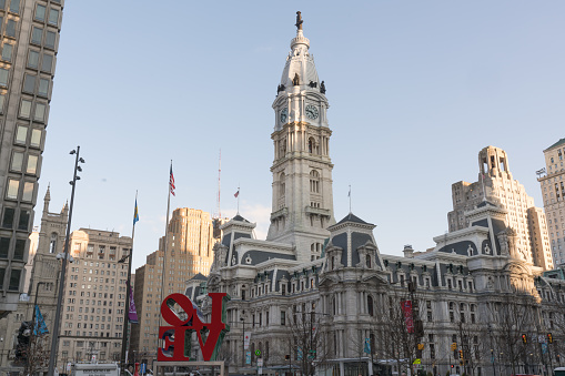PHILADELPHIA, PA - MARCH 10, 2018: Newly restored LOVE sculpture and City Hall from Love Park in Philadelphia, Pennsylvania