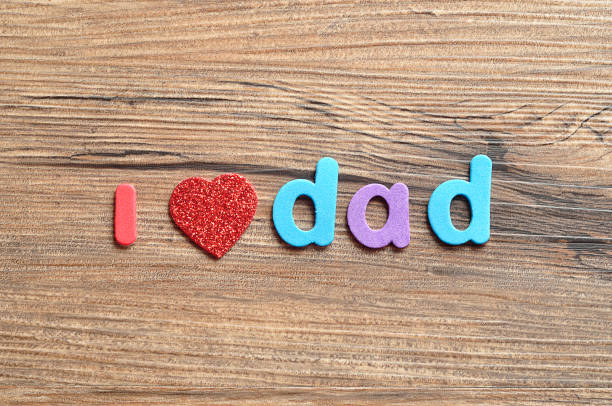 istock I love dad on a wooden background 939238986