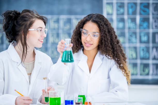 istock Girls in high school conducting scientific experiments 939240110