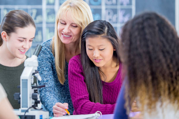 istock Woman teaches high school science 939240994