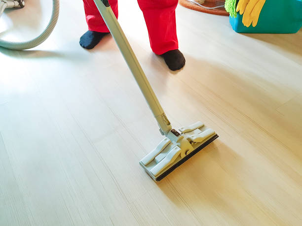 istock men vacuum the floor with steam 939243408