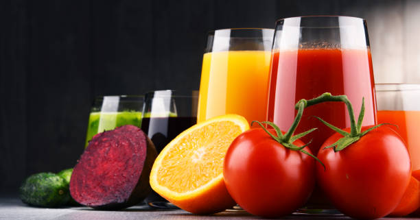istock Glasses with fresh organic vegetable and fruit juices 939244284
