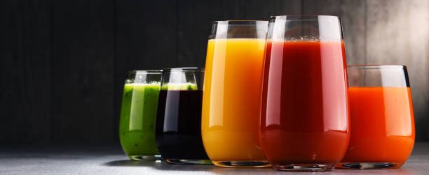 istock Glasses with fresh organic vegetable and fruit juices 939244366