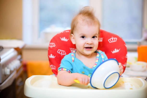 istock One year old child plays in the kitchen with dishes 939248480