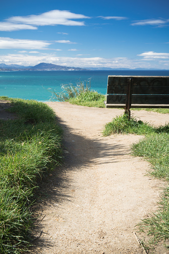relaxing moments, close up of bench with panoramic view on atlantic ocean, bidart, france