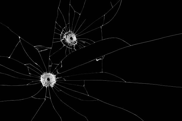 istock Two bullet holes on window isolated on black background. Cut out. 939260290