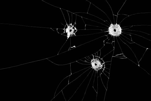 istock Three bullet holes on window isolated on black background. Cut out. 939260308