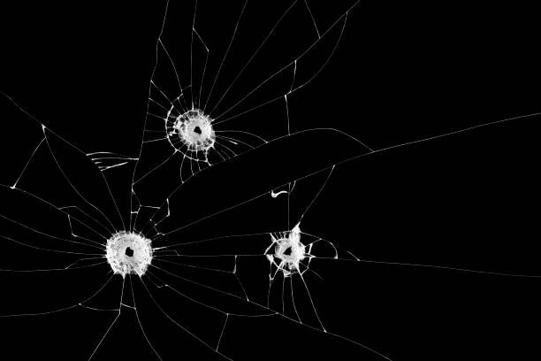 istock Three bullet holes on window isolated on black background. Cut out. 939261688