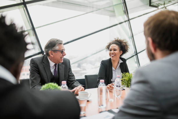 istock Group of businesspeople discussing an idea 939262586