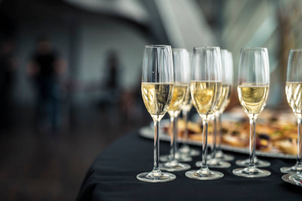 istock Champagne glassess on a table 939262712