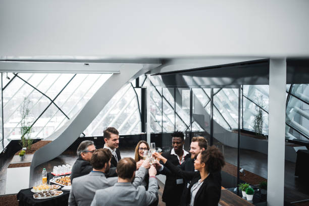 istock Businesspeople celebrating a special event and drinking champagne 939262832