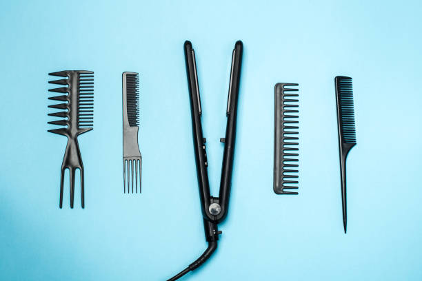 istock combs and hairdresser tools on blue background top view 939263706