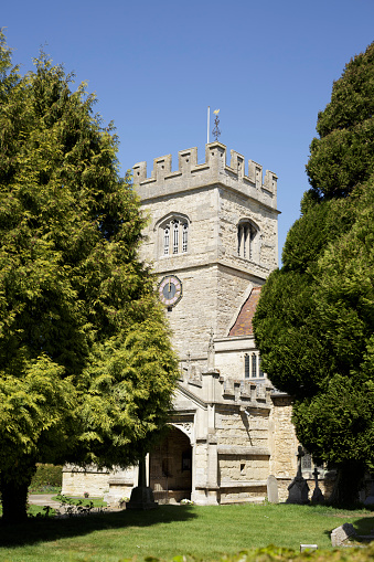 Winslow, UK - April 27, 2015. 14th century church tower of St Laurence's church in Winslow, Buckinghamshire. The church was restored in the 19th century and is now a grade II listed building.