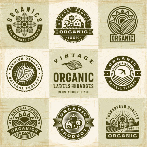 Vintage Organic Labels And Badges Set A set of vintage organic labels and badges in retro woodcut style. Editable EPS10 vector illustration with clipping mask and transparency. organic stock illustrations