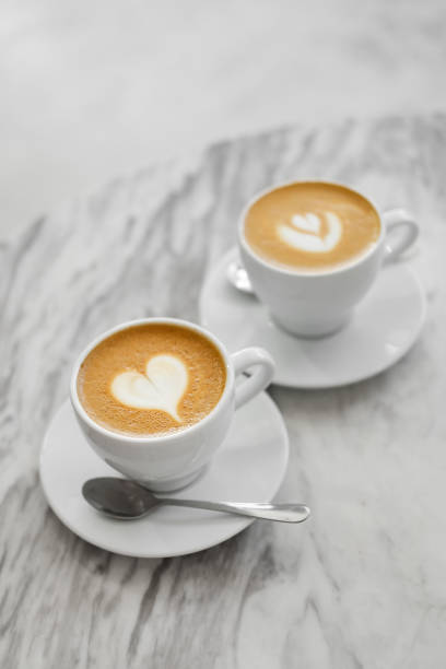 istock Two cups of coffee  on white background 939281022