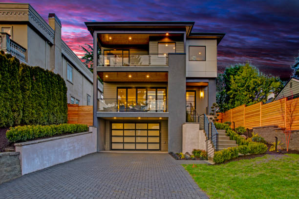 Luxury modern home exterior at sunset stock photo