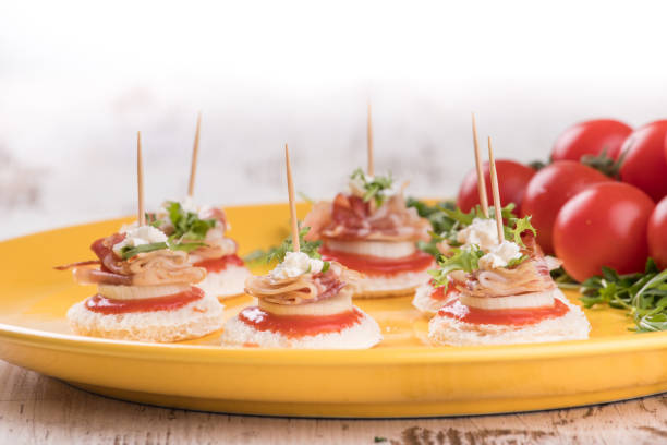 istock Canapes with bacon and tomato 939287186
