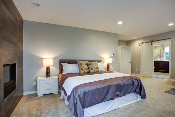 istock Upstairs stunning master bedroom with fireplace and private deck 939287246