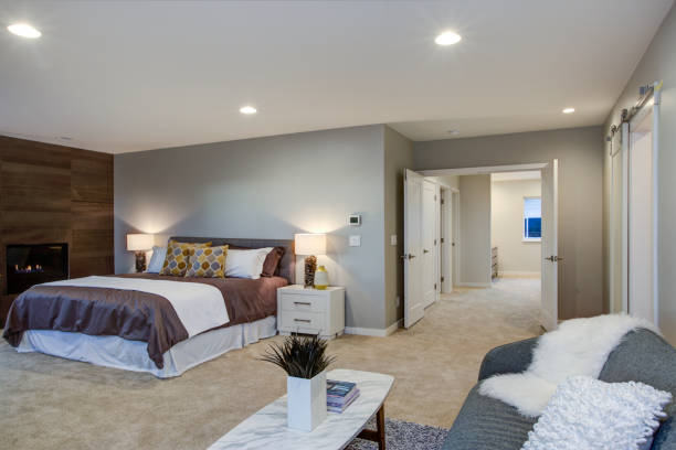 istock Upstairs stunning master bedroom with fireplace and private deck 939287394