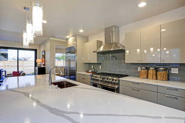 istock Sleek modern kitchen design with a long center island. 939287436