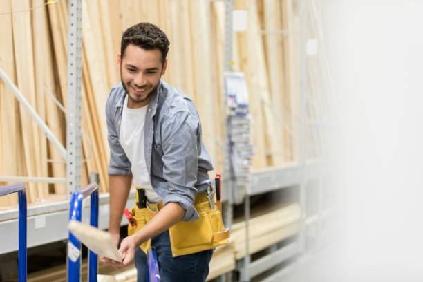 istock Cheerful man working in home improvement store 939287446