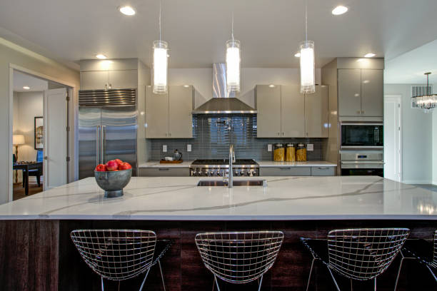 istock Sleek modern kitchen design with a gray center island 939288014