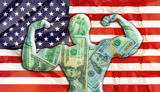 Abstract business background. Concept of powerful United States American Dollar. United States Flag and bodybuilder shaped USD currency. Financial concept about exchange rate of American dollars.