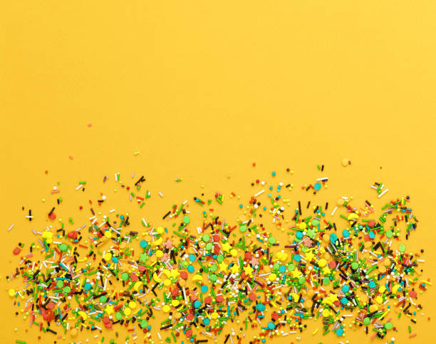 istock Easter decoration with candy powder colorful on yellow background. 939291282