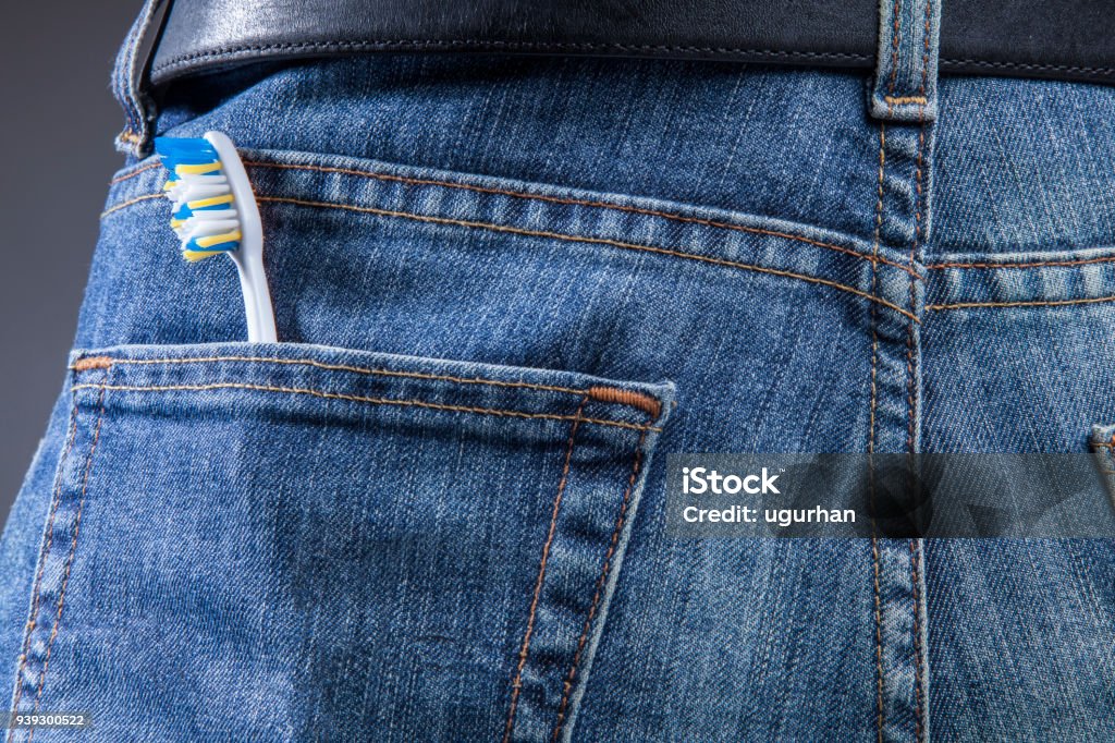 Jeans with pocket and toothbrush Adult Stock Photo Jeans with pocket and toothbrush Adult Stock Photo