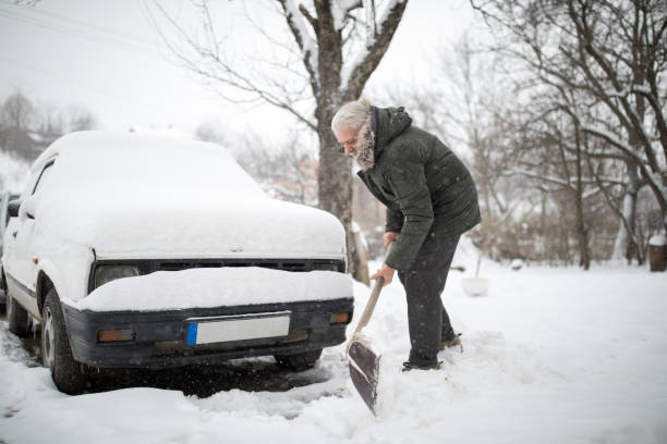 istock Stuck in snow. Man with shovel removing snow 939300620