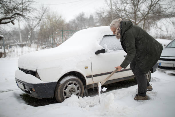 istock Stuck in snow. Man with shovel removing snow 939300724