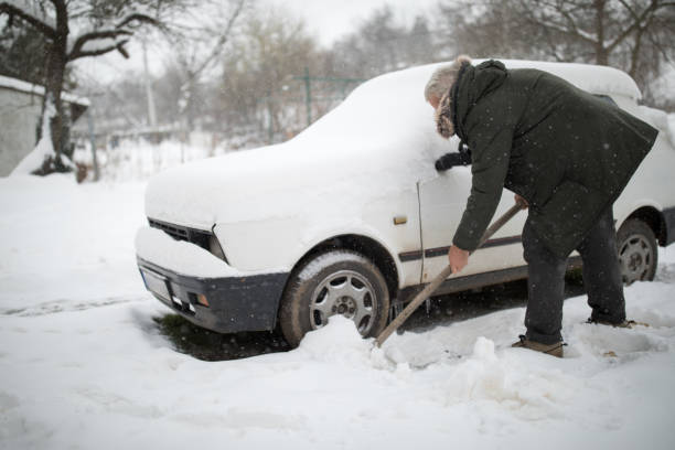 istock Stuck in snow. Man with shovel removing snow 939300728